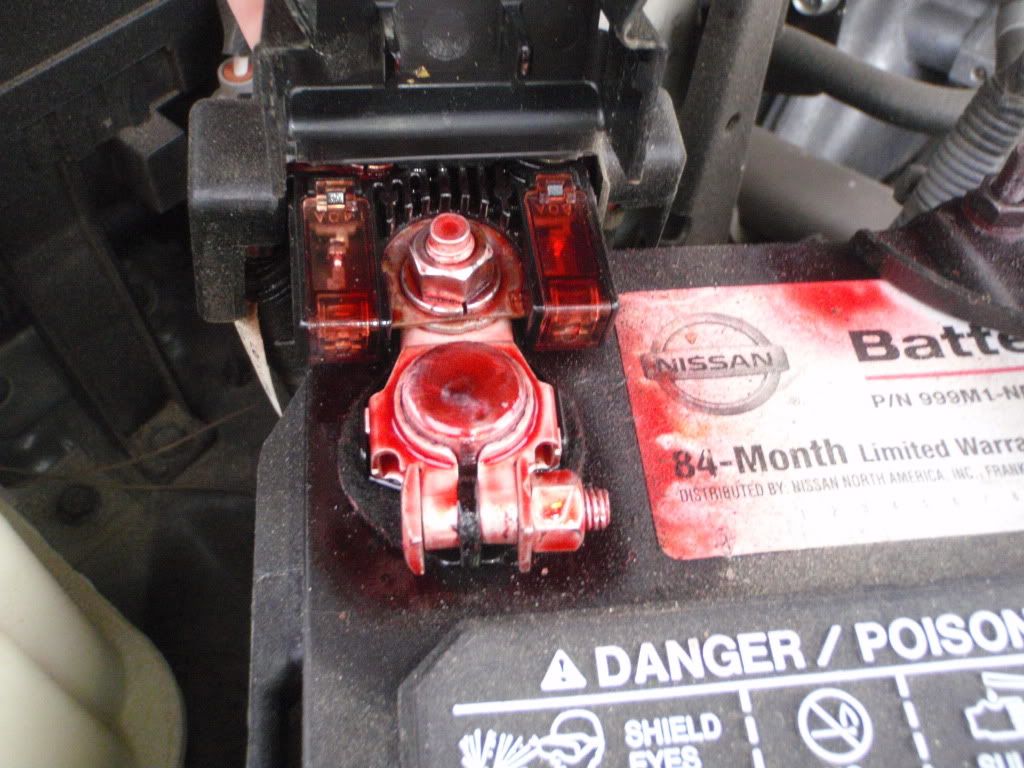 Red sticky substance on the battery? Second Generation Nissan Xterra